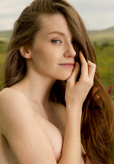 Emily Bloom displays her perfect curves in the flower field