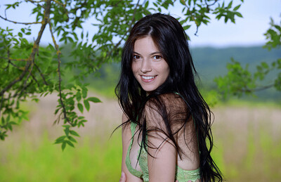 Stunning model Aleksandrina is outdoors in nature showing her athletic all natural body